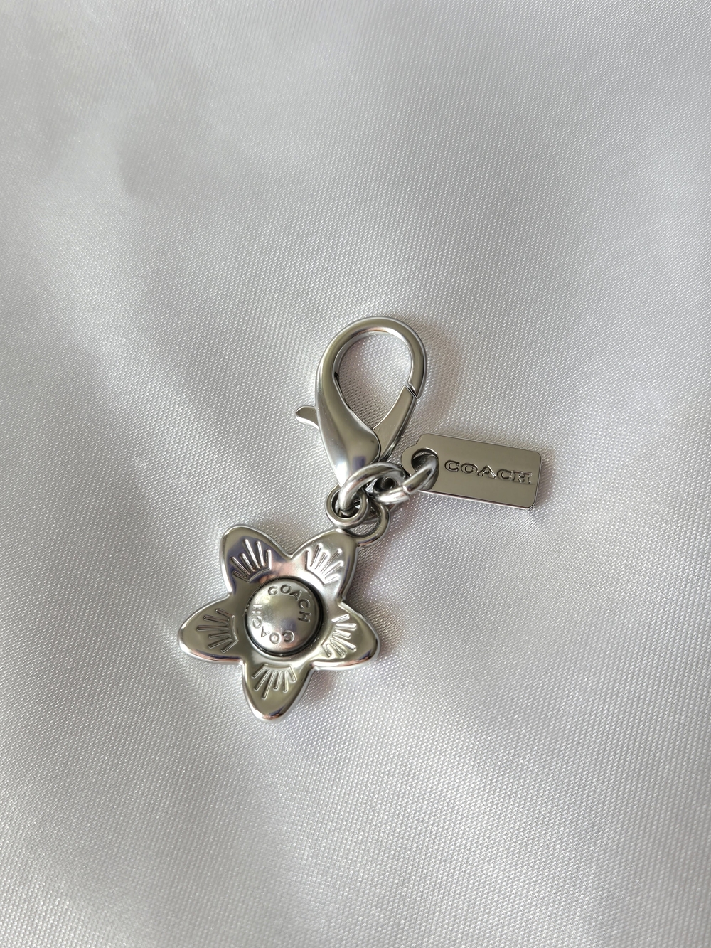 Coach Silver Flower Charm Key Clip with Logo Tag